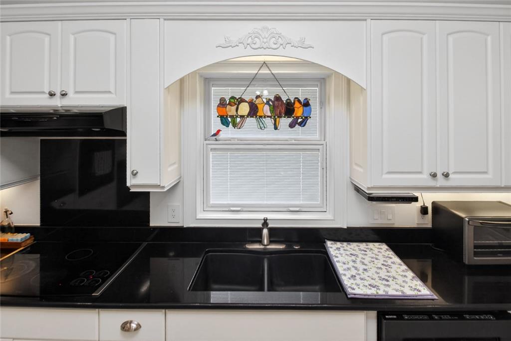 4113 Ledan Extension Gainesville, GA 30506 - Photo 71 of 195 a kitchen with granite countertop a stove and a sink
