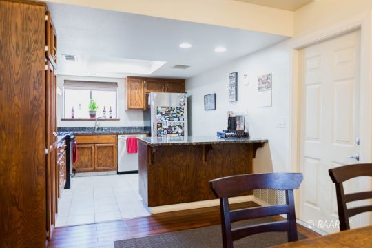 809 Charles Court Ridgecrest, CA 93555 - Photo 11 of 33 a living room with furniture and a wooden floor