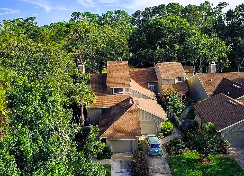1 Turtleback Trail Ponte Vedra Beach, FL 32082 - Photo 1 of 23 an aerial view of a house with yard and outdoor seating