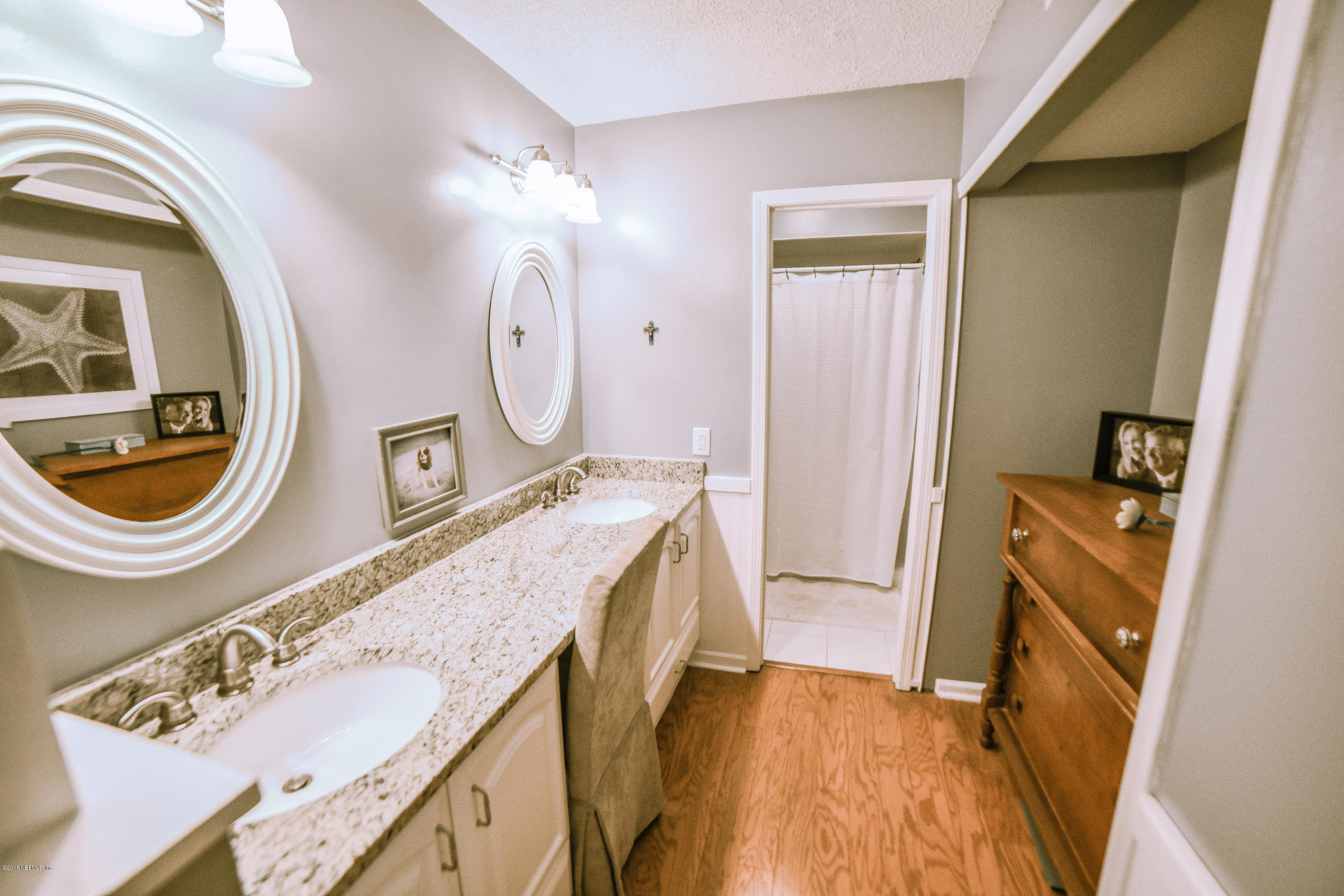1 Turtleback Trail Ponte Vedra Beach, FL 32082 - Photo 14 of 23 a bathroom with a granite countertop sink and a mirror