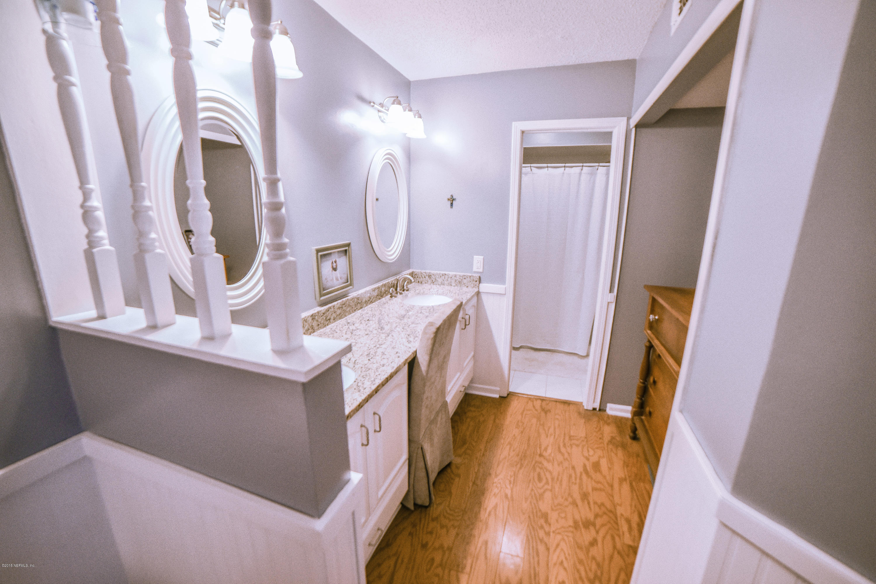 1 Turtleback Trail Ponte Vedra Beach, FL 32082 - Photo 15 of 23 a bathroom with a sink vanity and mirror