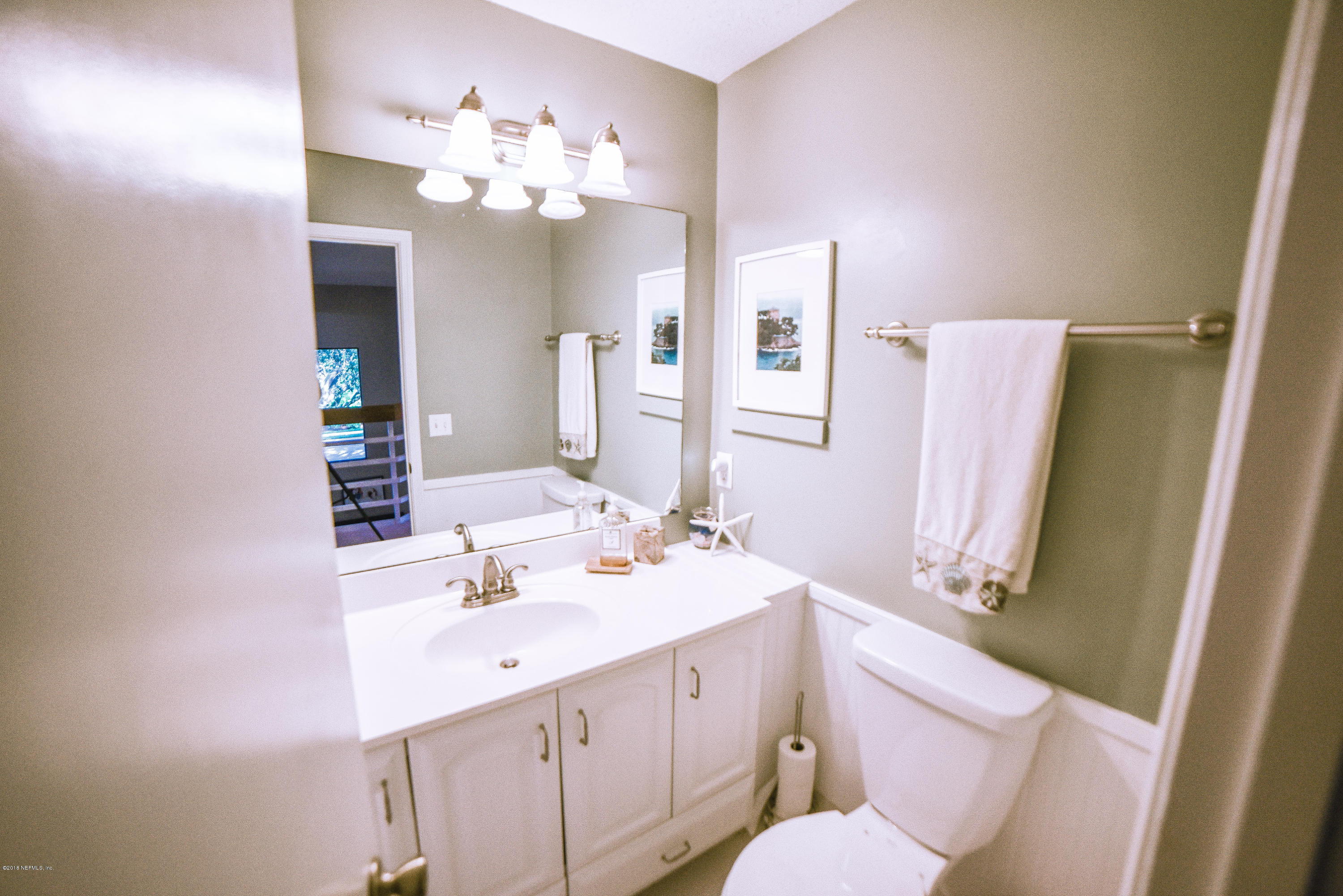 1 Turtleback Trail Ponte Vedra Beach, FL 32082 - Photo 18 of 23 a bathroom with a sink a toilet a mirror a vanity and shower view