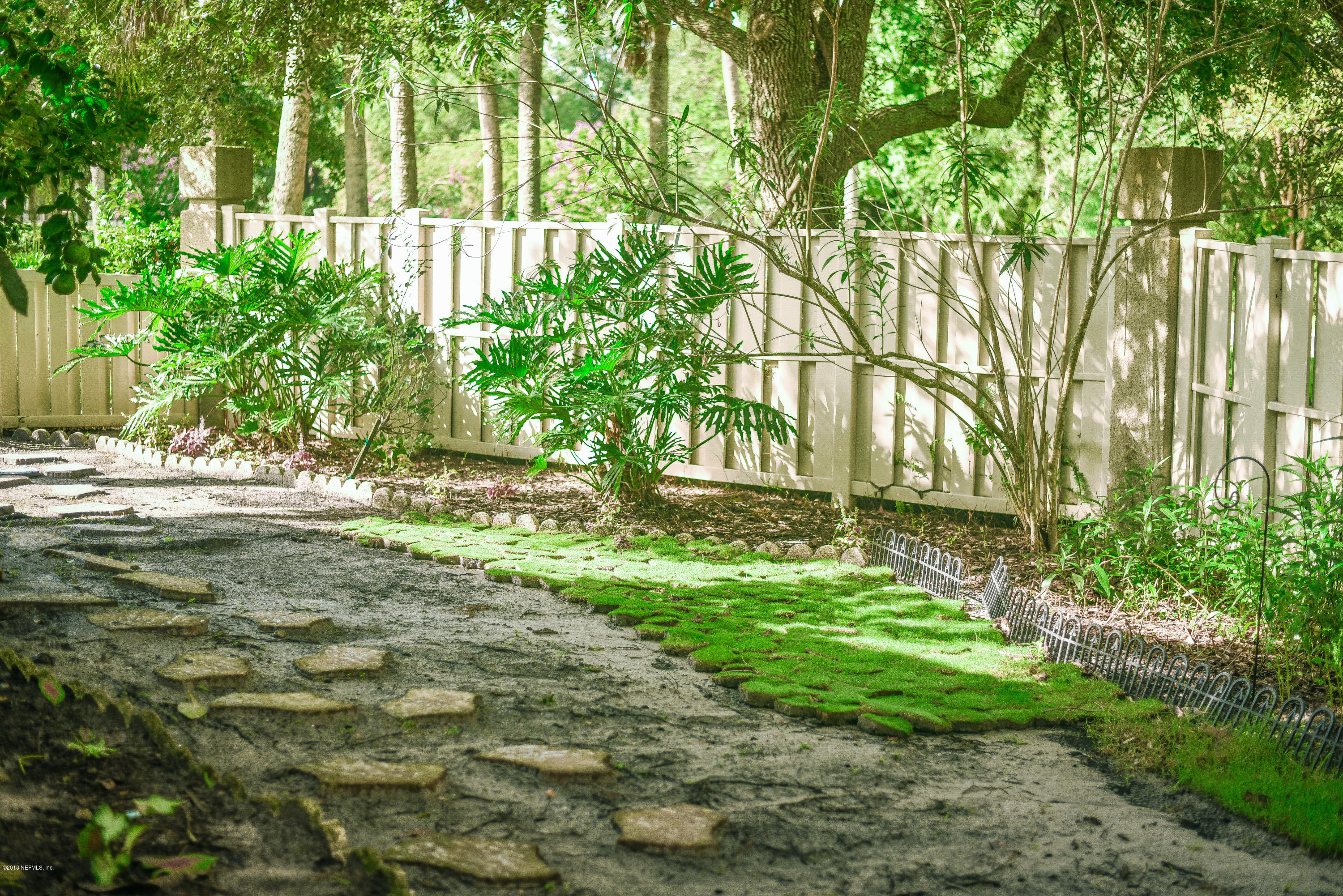 1 Turtleback Trail Ponte Vedra Beach, FL 32082 - Photo 20 of 23 a backyard of a house with a yard and outdoor seating