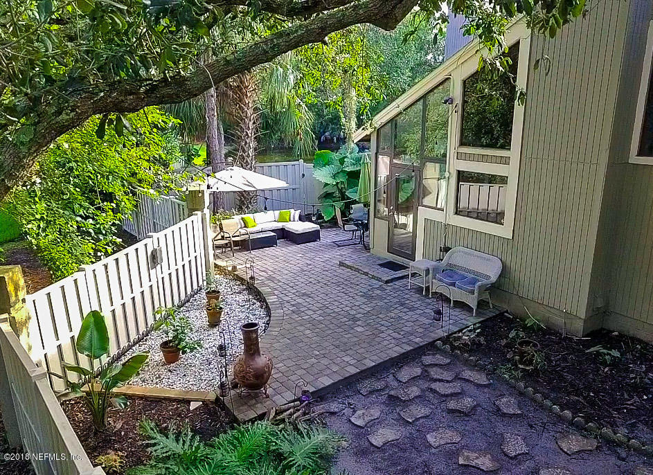 1 Turtleback Trail Ponte Vedra Beach, FL 32082 - Photo 22 of 23 a view of a backyard with a patio