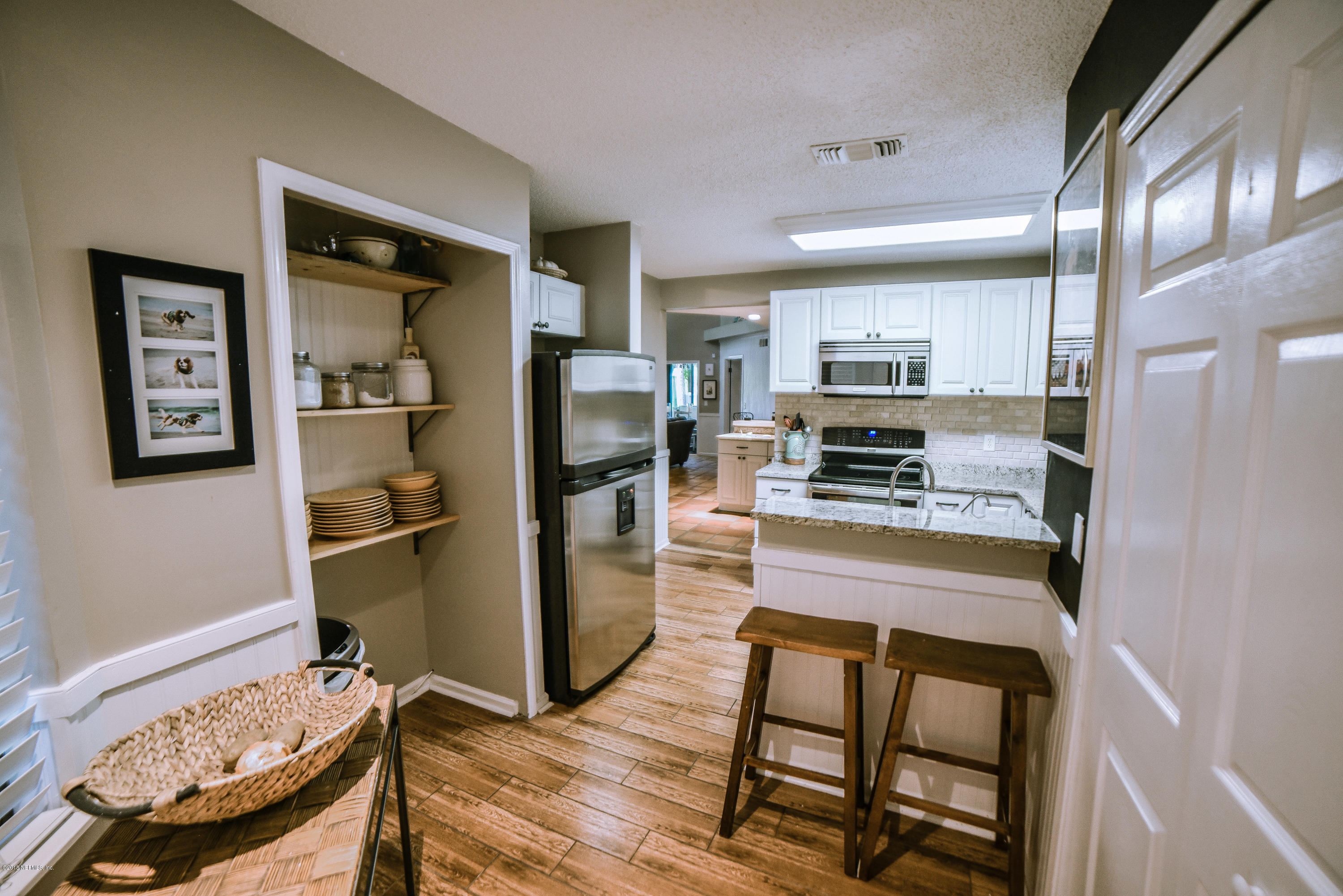 1 Turtleback Trail Ponte Vedra Beach, FL 32082 - Photo 6 of 23 a kitchen with stainless steel appliances granite countertop a refrigerator and a stove top oven