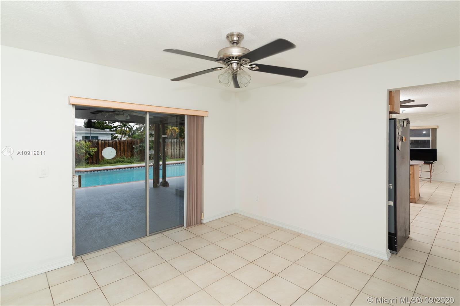 11203 Ladino Street Boca Raton, FL 33428 - Photo 11 of 36 Formal Dinning room area looking into the outside and to the Kitchen in 11203 Ladino St. Boca Raton FL 33428 - 3953
