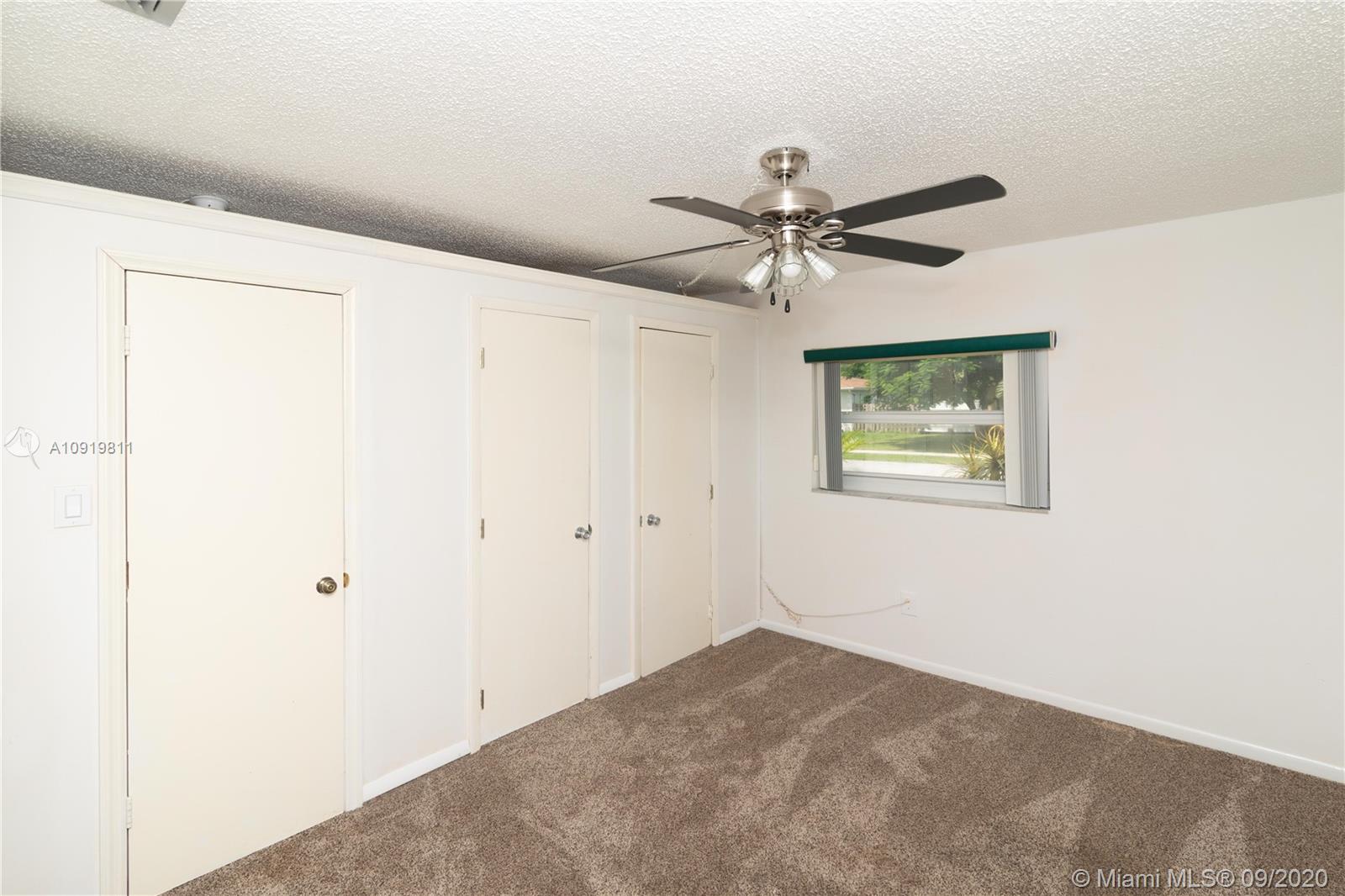 11203 Ladino Street Boca Raton, FL 33428 - Photo 19 of 36 Second Bedroom in 11203 Ladino St. Boca Raton. The 3 doors are closet opening.