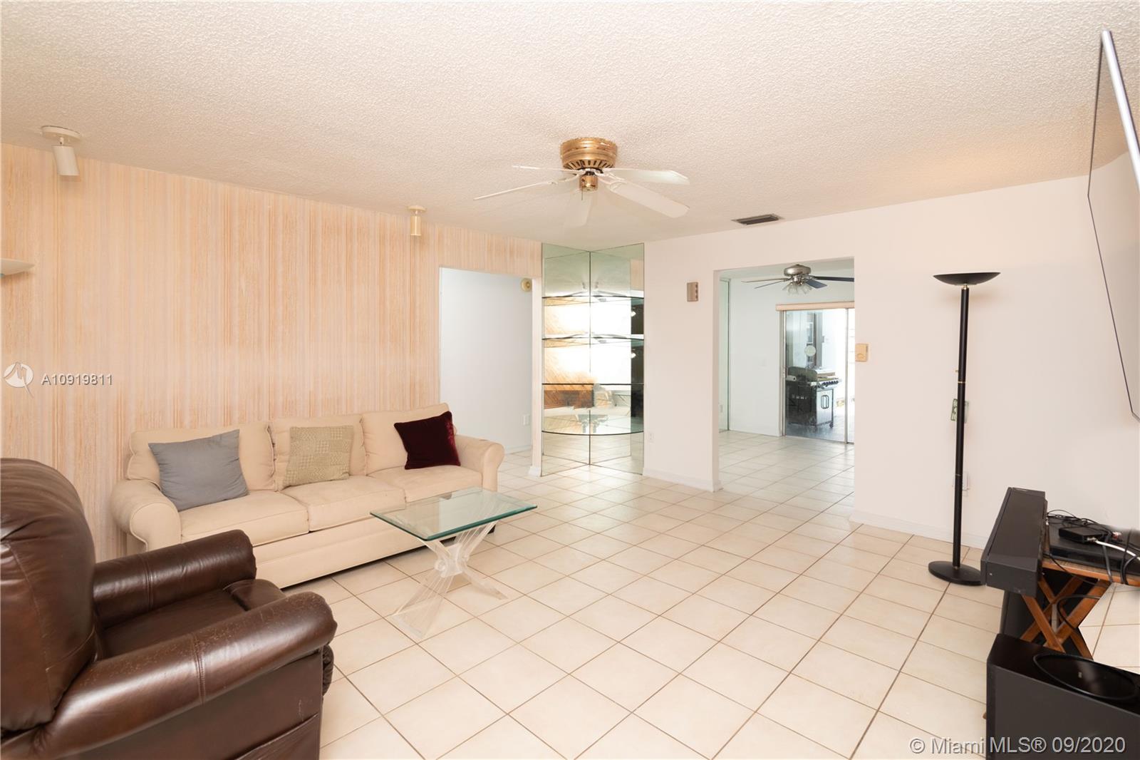 11203 Ladino Street Boca Raton, FL 33428 - Photo 6 of 36 Living room area looking into the Formal Dinning area in 11203 Ladino St. Boca Raton FL 33428 - 3953