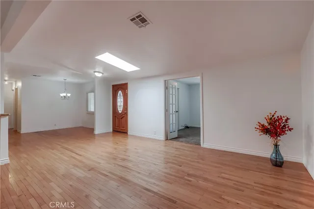 a kitchen with granite countertop cabinets stainless steel appliances and wooden cabinets