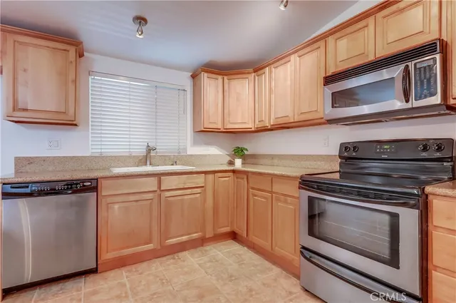 a view of a room with wooden floor and windows