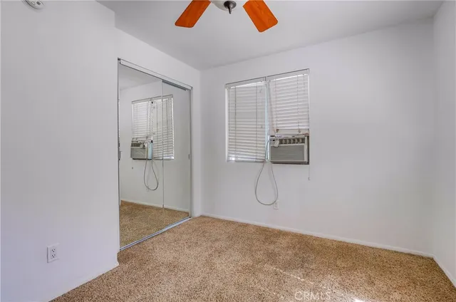 a bathroom with a tub double vanity sink and mirror