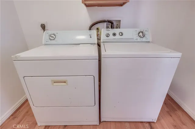 a view of a road with a wooden fence