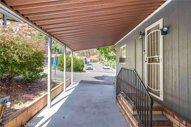 a view of a building with mountains in the background