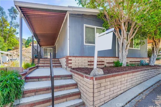 a front view of a house with a staircase