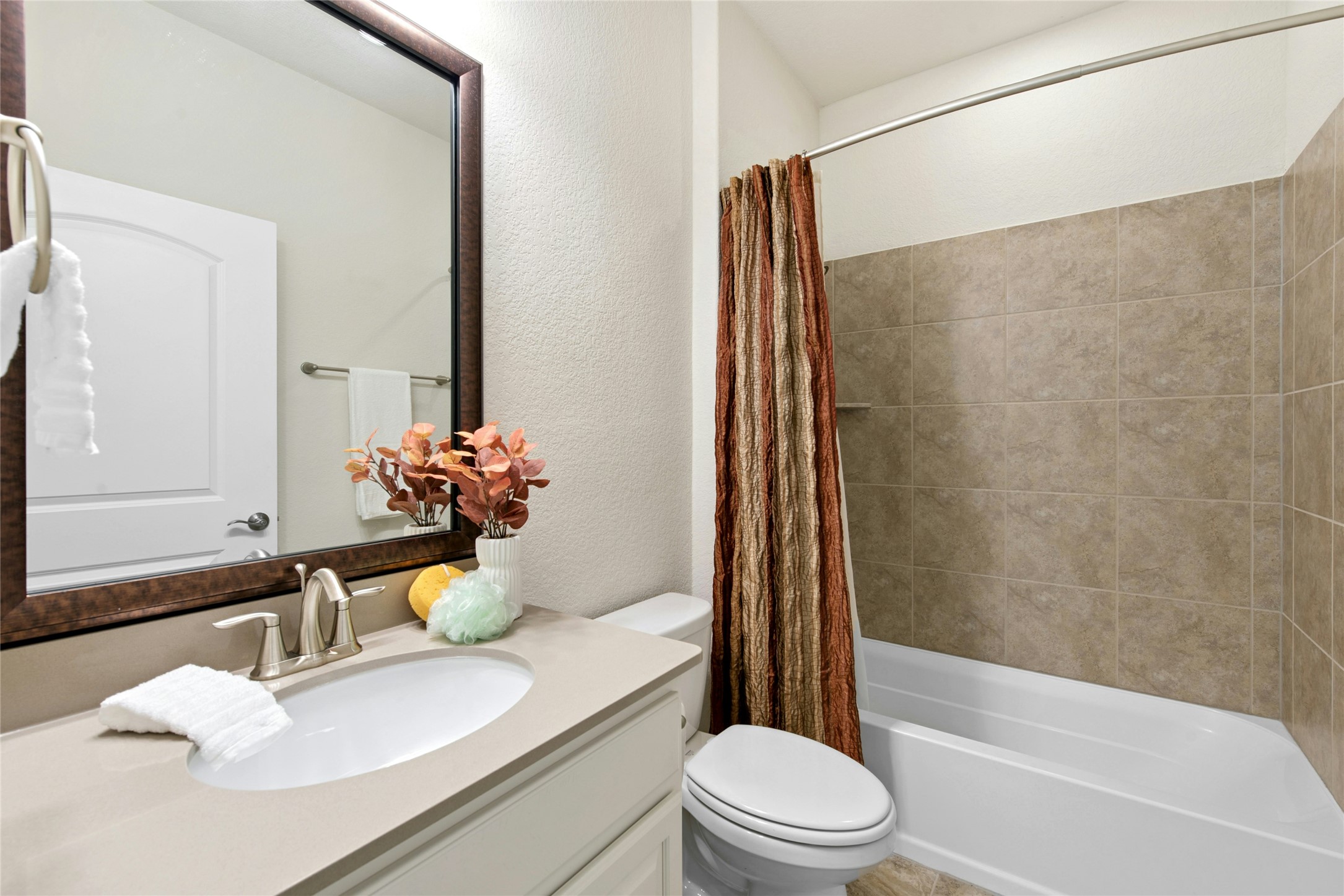 105 Marfa Cove Georgetown, TX 78633 - Photo 24 of 36 a bathroom with a granite countertop sink toilet and shower