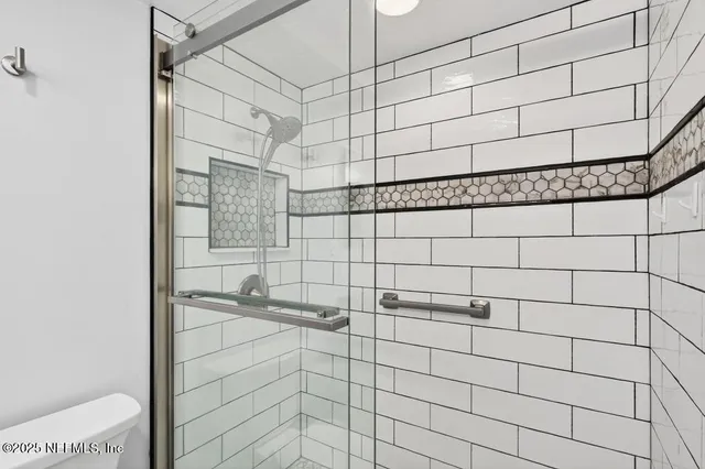 an aerial view of a building and trees