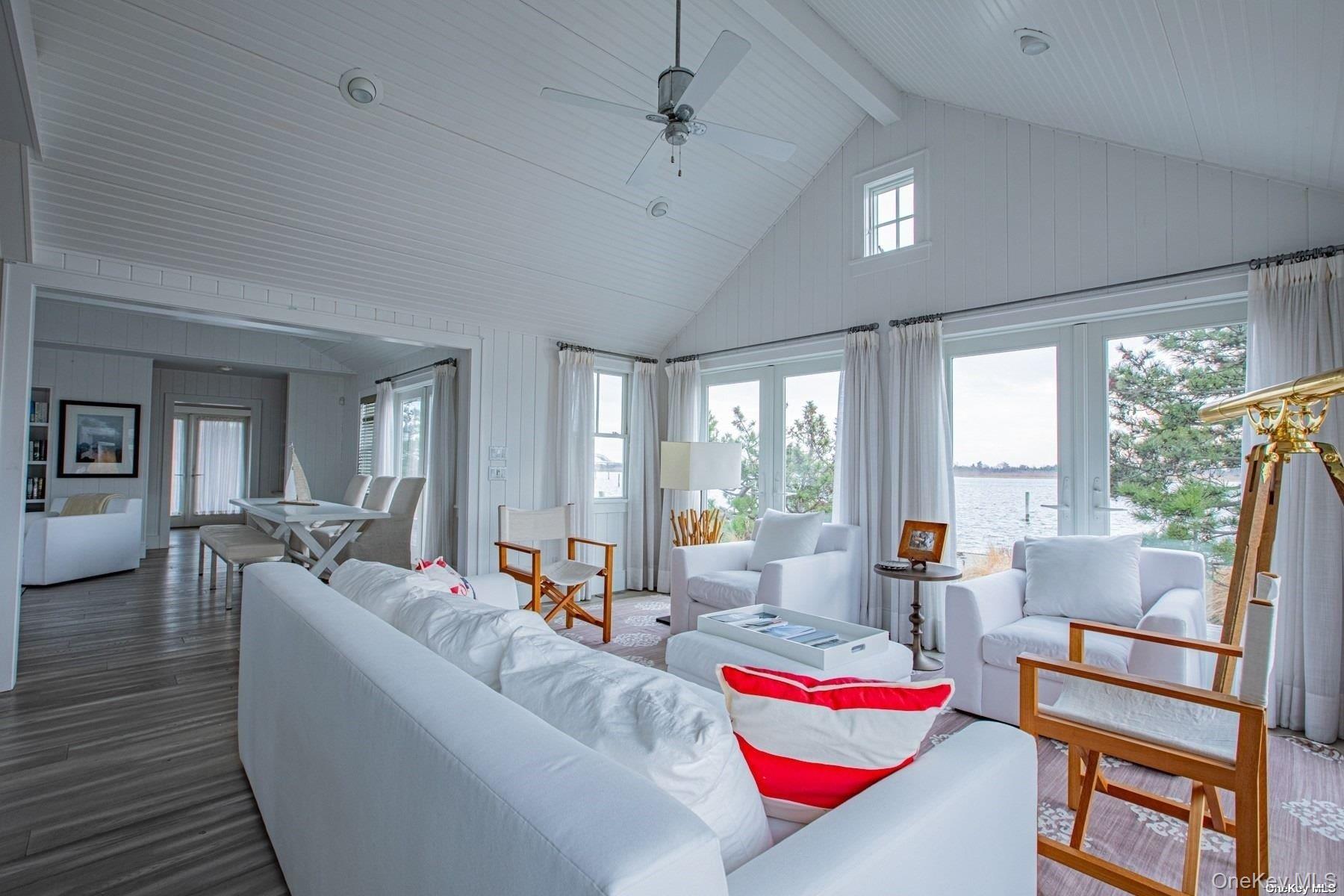 11 Captree Island Babylon, NY 11702 - Photo 12 of 31 a living room with furniture and a large window