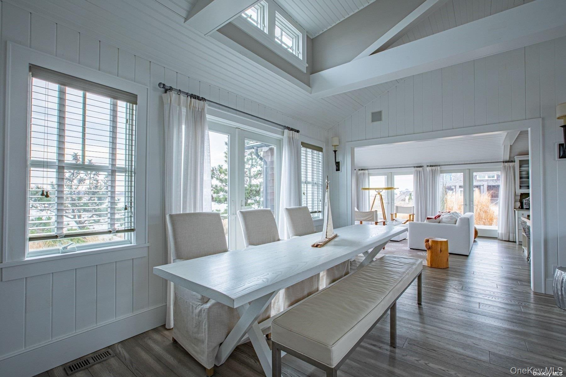 11 Captree Island Babylon, NY 11702 - Photo 13 of 31 a view of a dining room with furniture wooden floor and a chandelier