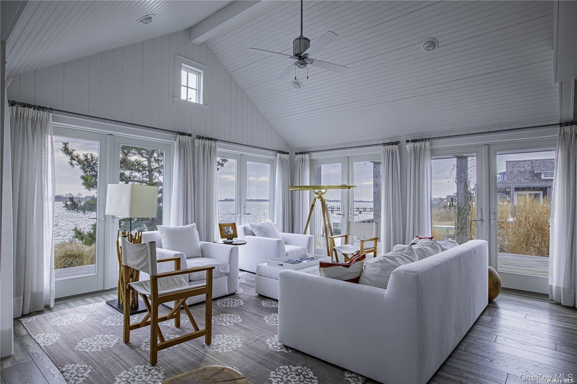 11 Captree Island Babylon, NY 11702 - Photo 15 of 31 a living room with furniture and a large window