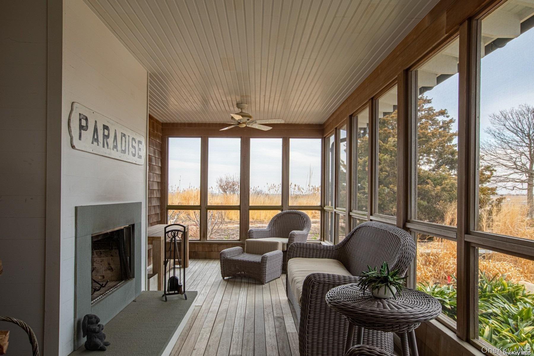 11 Captree Island Babylon, NY 11702 - Photo 16 of 31 a living room with furniture and a fireplace