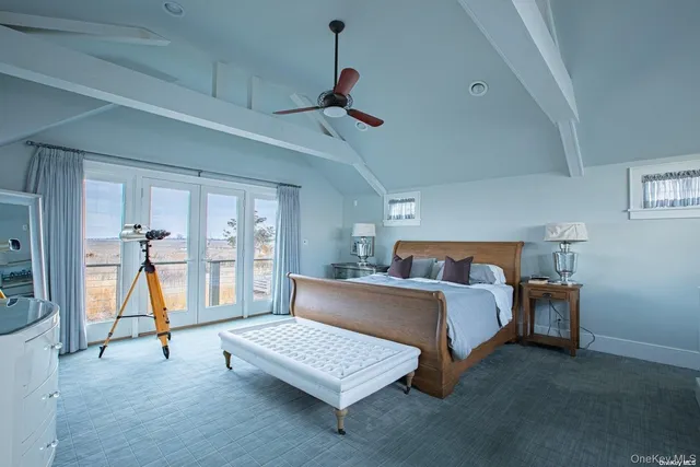 a bedroom with a bed couch and a window