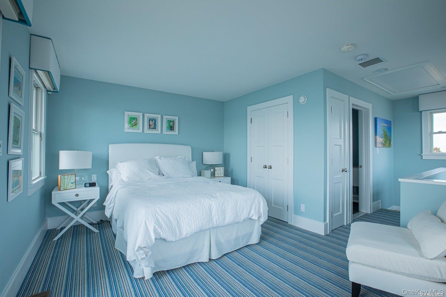 11 Captree Island Babylon, NY 11702 - Photo 21 of 31 a bedroom with a bed and wooden floor