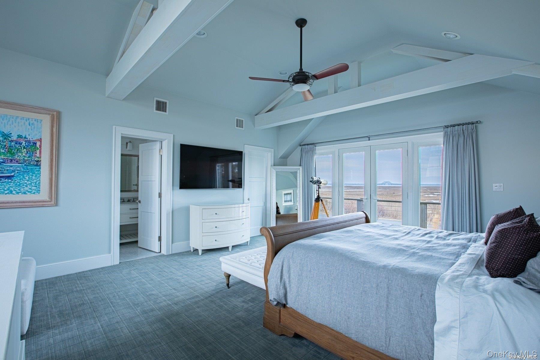 11 Captree Island Babylon, NY 11702 - Photo 22 of 31 a bedroom with a bed and a flat screen tv