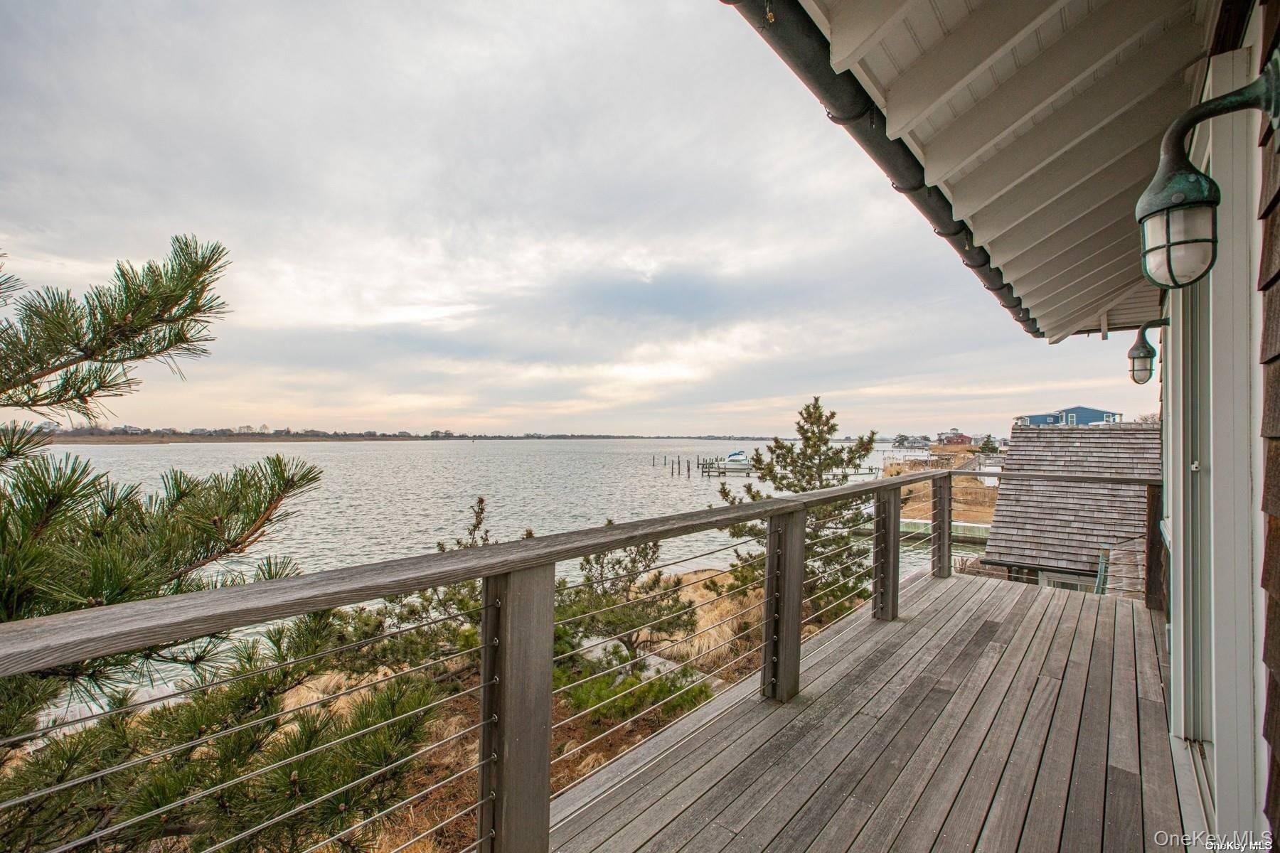 11 Captree Island Babylon, NY 11702 - Photo 31 of 31 a view of a balcony with wooden floor next to a yard