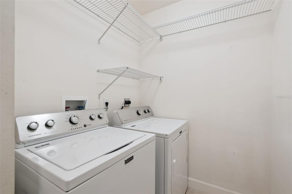 1400 Celebration Avenue, Unit 305 Celebration, FL 34747 - Photo 12 of 38 a utility room with dryer and washer