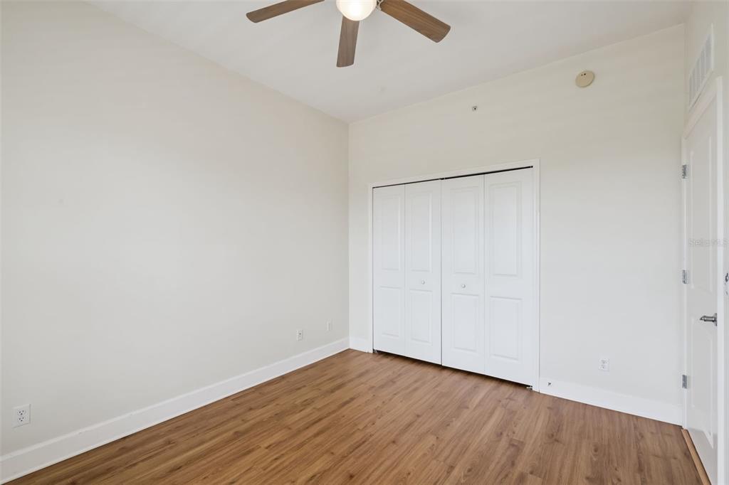 1400 Celebration Avenue, Unit 305 Celebration, FL 34747 - Photo 14 of 38 a view of an empty room with wooden floor