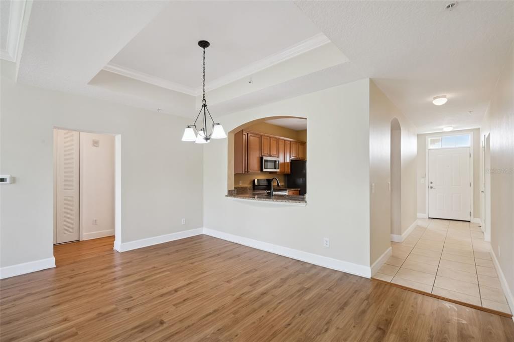 1400 Celebration Avenue, Unit 305 Celebration, FL 34747 - Photo 15 of 38 a view of a room with wooden floor staircase and a living room