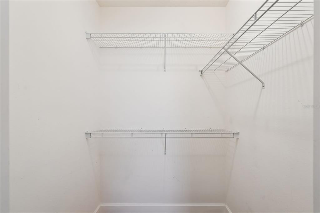 1400 Celebration Avenue, Unit 305 Celebration, FL 34747 - Photo 19 of 38 a view of a room with racks on the wall