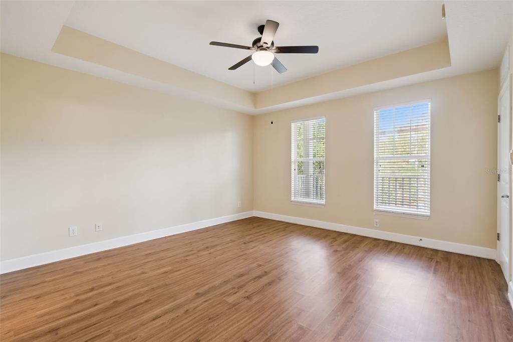 1400 Celebration Avenue, Unit 305 Celebration, FL 34747 - Photo 22 of 38 wooden floor in an empty room with a window