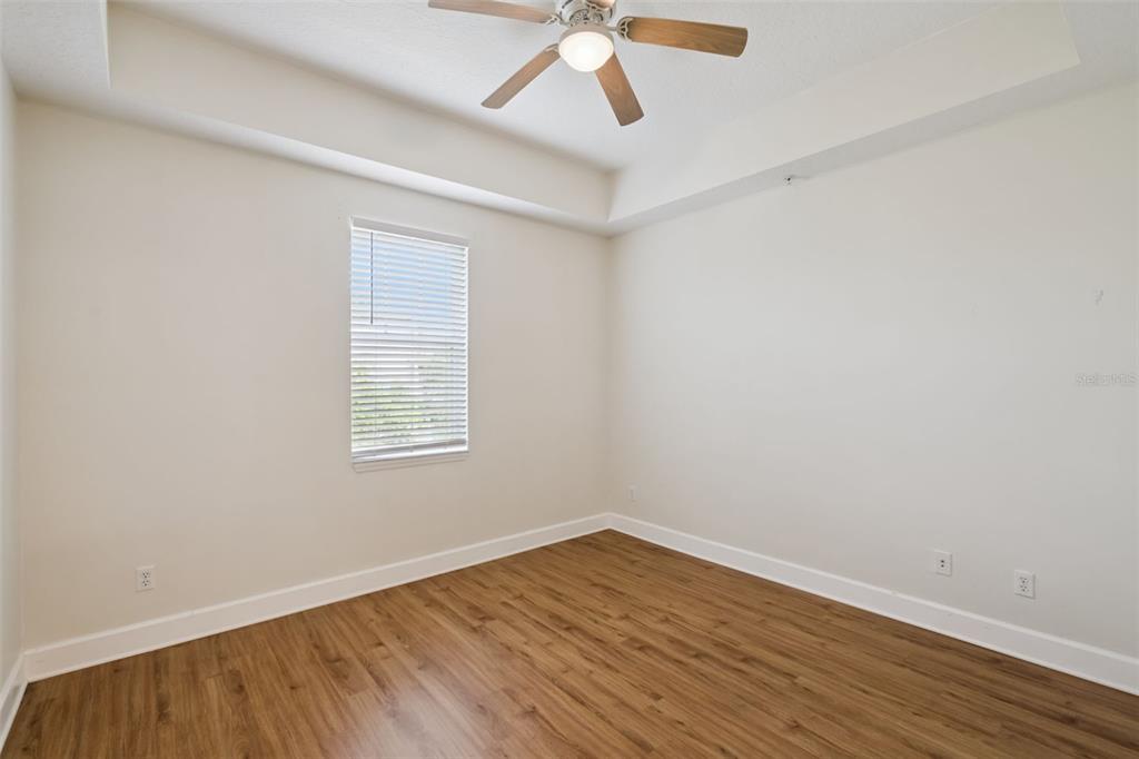 1400 Celebration Avenue, Unit 305 Celebration, FL 34747 - Photo 23 of 38 wooden floor in an empty room with a window