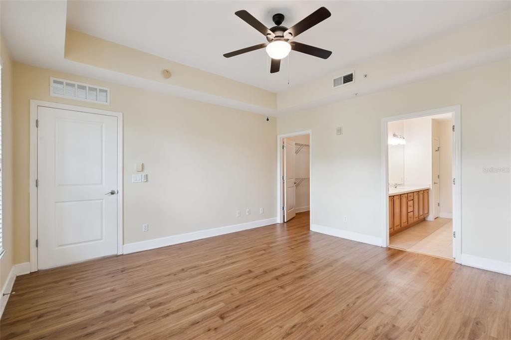 1400 Celebration Avenue, Unit 305 Celebration, FL 34747 - Photo 24 of 38 a view of an empty room with wooden floor