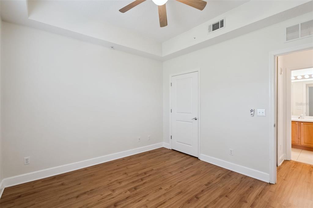 1400 Celebration Avenue, Unit 305 Celebration, FL 34747 - Photo 28 of 38 wooden floor in an empty room