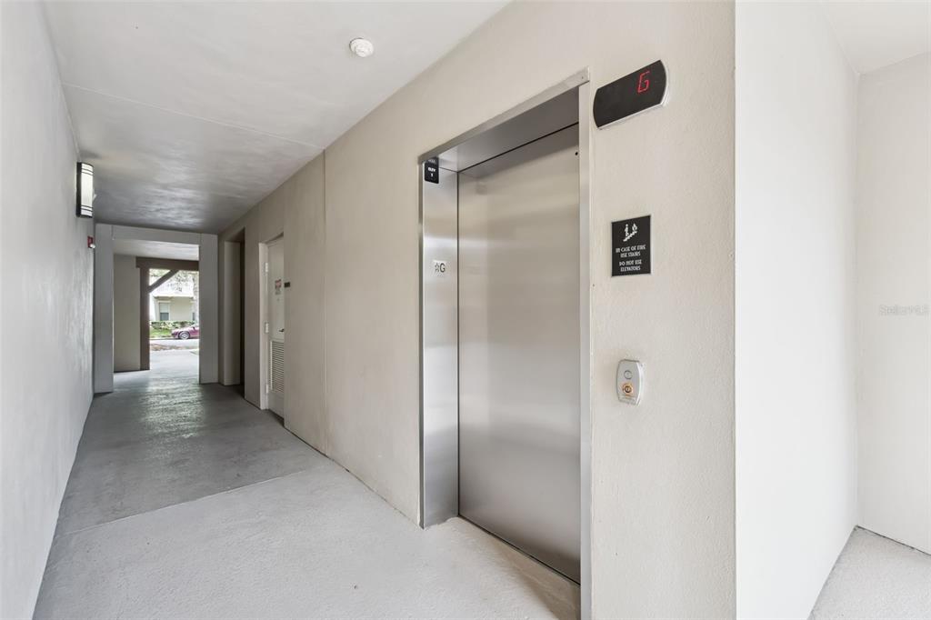 1400 Celebration Avenue, Unit 305 Celebration, FL 34747 - Photo 30 of 38 a view of a hallway with some doors