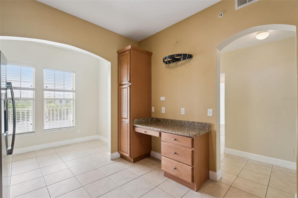 1400 Celebration Avenue, Unit 305 Celebration, FL 34747 - Photo 8 of 38 a spacious bathroom with a granite countertop sink a mirror and a shower