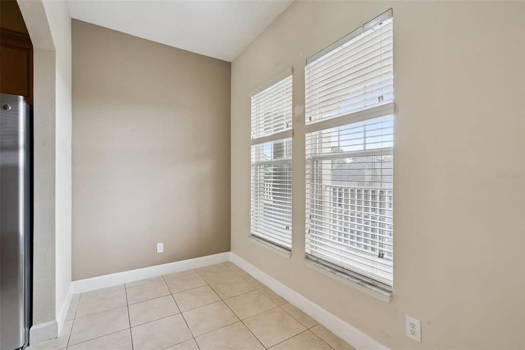 1400 Celebration Avenue, Unit 305 Celebration, FL 34747 - Photo 9 of 38 a view of empty room with windows