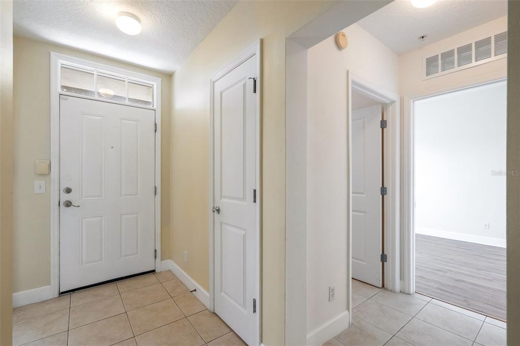 1400 Celebration Avenue, Unit 305 Celebration, FL 34747 - Photo 10 of 38 a view of a hallway with closet area