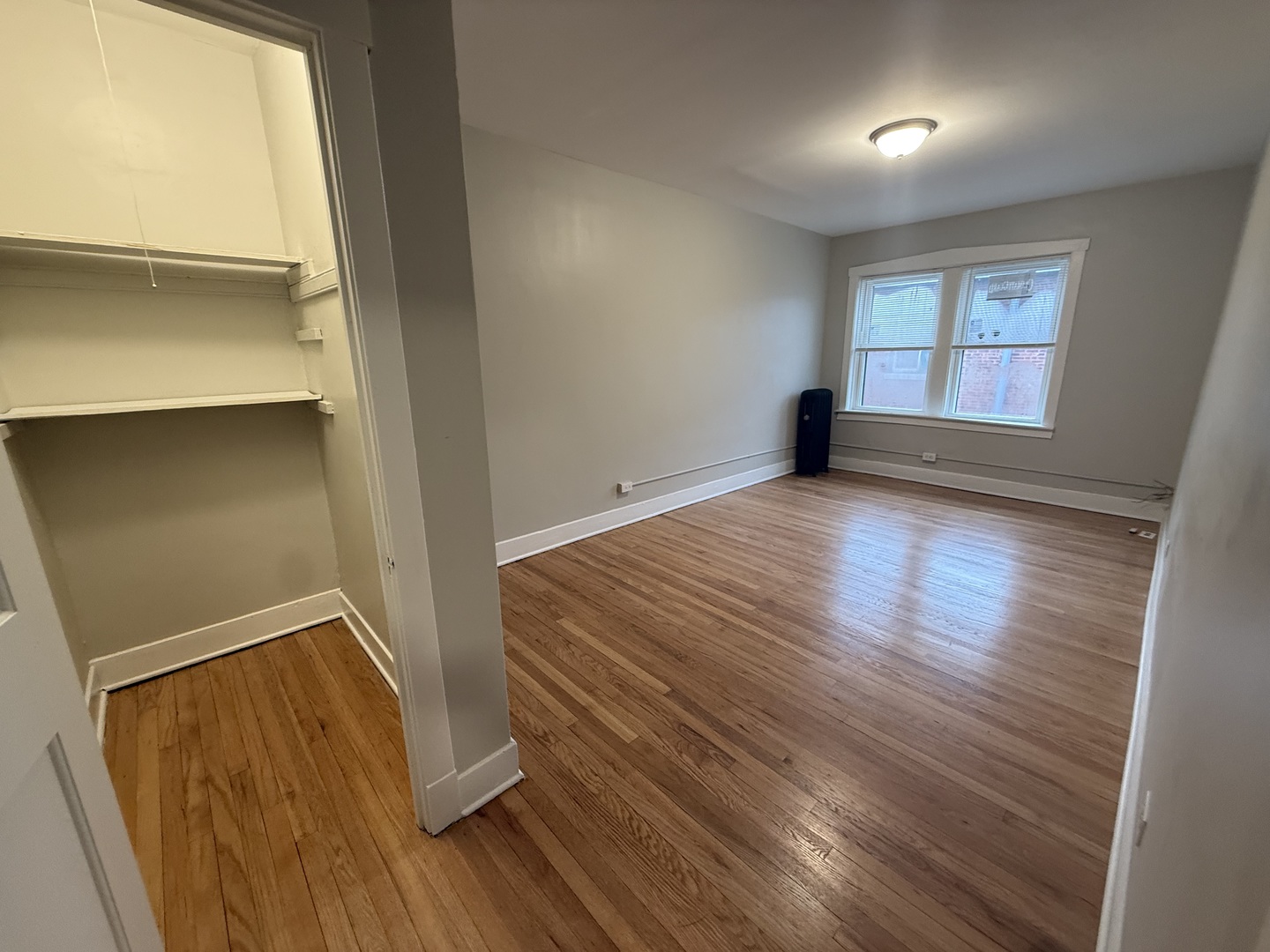 106 Lincoln Avenue, Unit 3W Riverside, IL 60546 - Photo 6 of 10 wooden floor in an empty room with a window