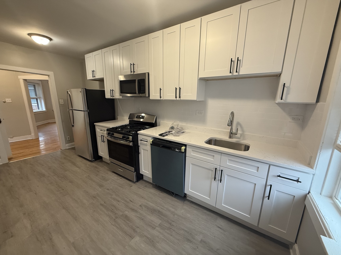 106 Lincoln Avenue, Unit 3W Riverside, IL 60546 - Photo 9 of 10 a kitchen with granite countertop white cabinets and stainless steel appliances