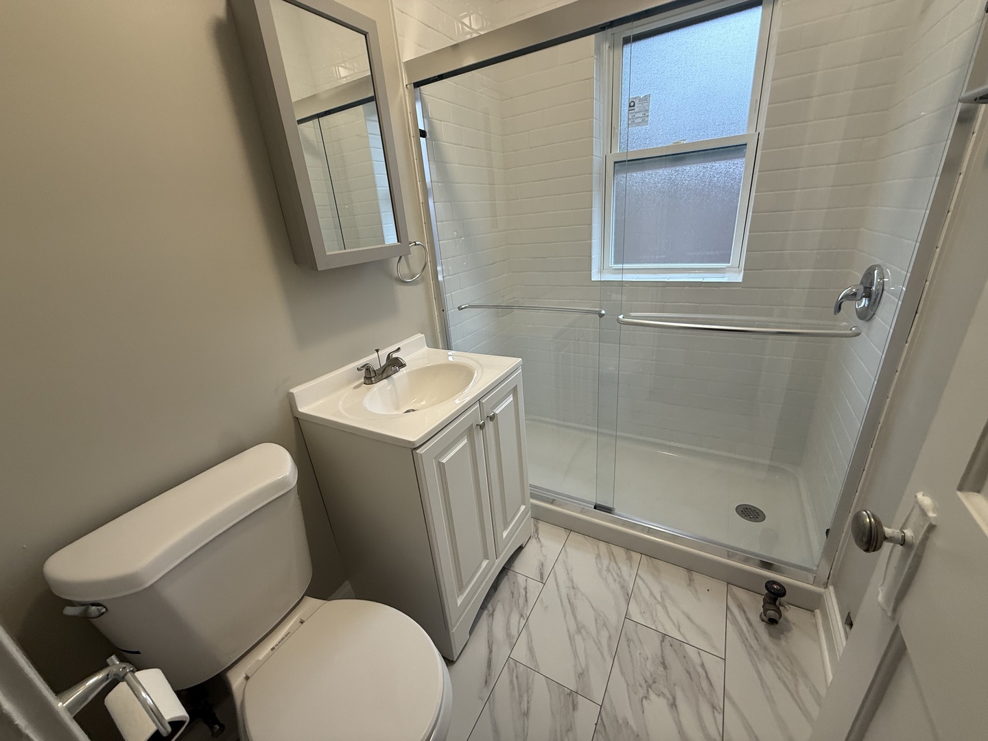 106 Lincoln Avenue, Unit 3W Riverside, IL 60546 - Photo 10 of 10 a white toilet sitting next to a bathroom sink