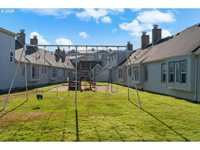 a swimming pool with trees in front of it