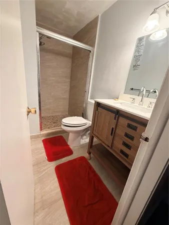 a bathroom with a toilet and a sink