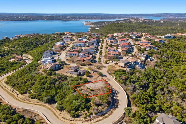 an aerial view of a house with a lake view