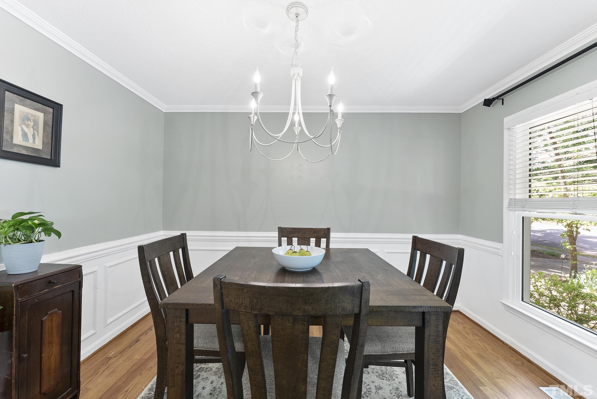 4205 Pleasant Grove Church Road Raleigh, NC 27613 - Photo 11 of 34 a view of a dining room with furniture window and wooden floor