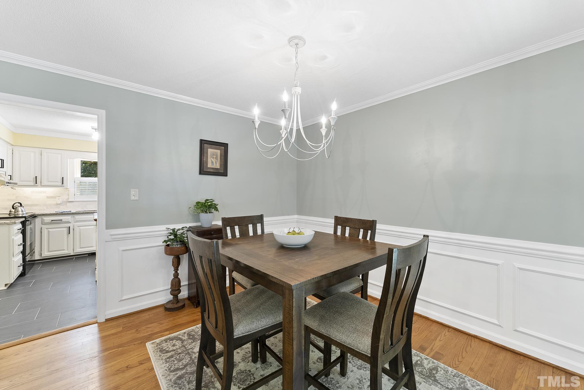 4205 Pleasant Grove Church Road Raleigh, NC 27613 - Photo 12 of 34 a view of a dining room with furniture and wooden floor