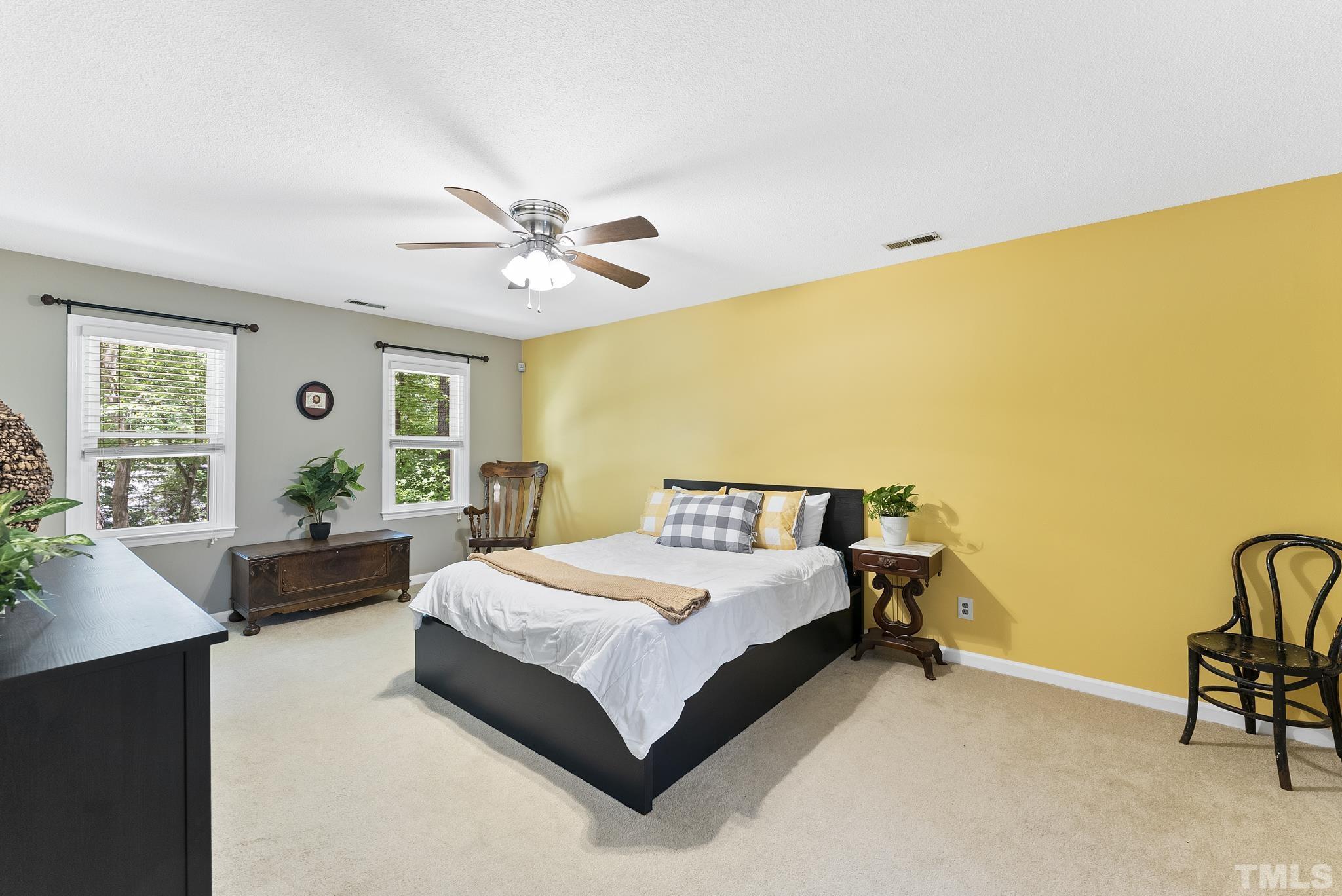 4205 Pleasant Grove Church Road Raleigh, NC 27613 - Photo 13 of 34 a bedroom with a bed and a couch