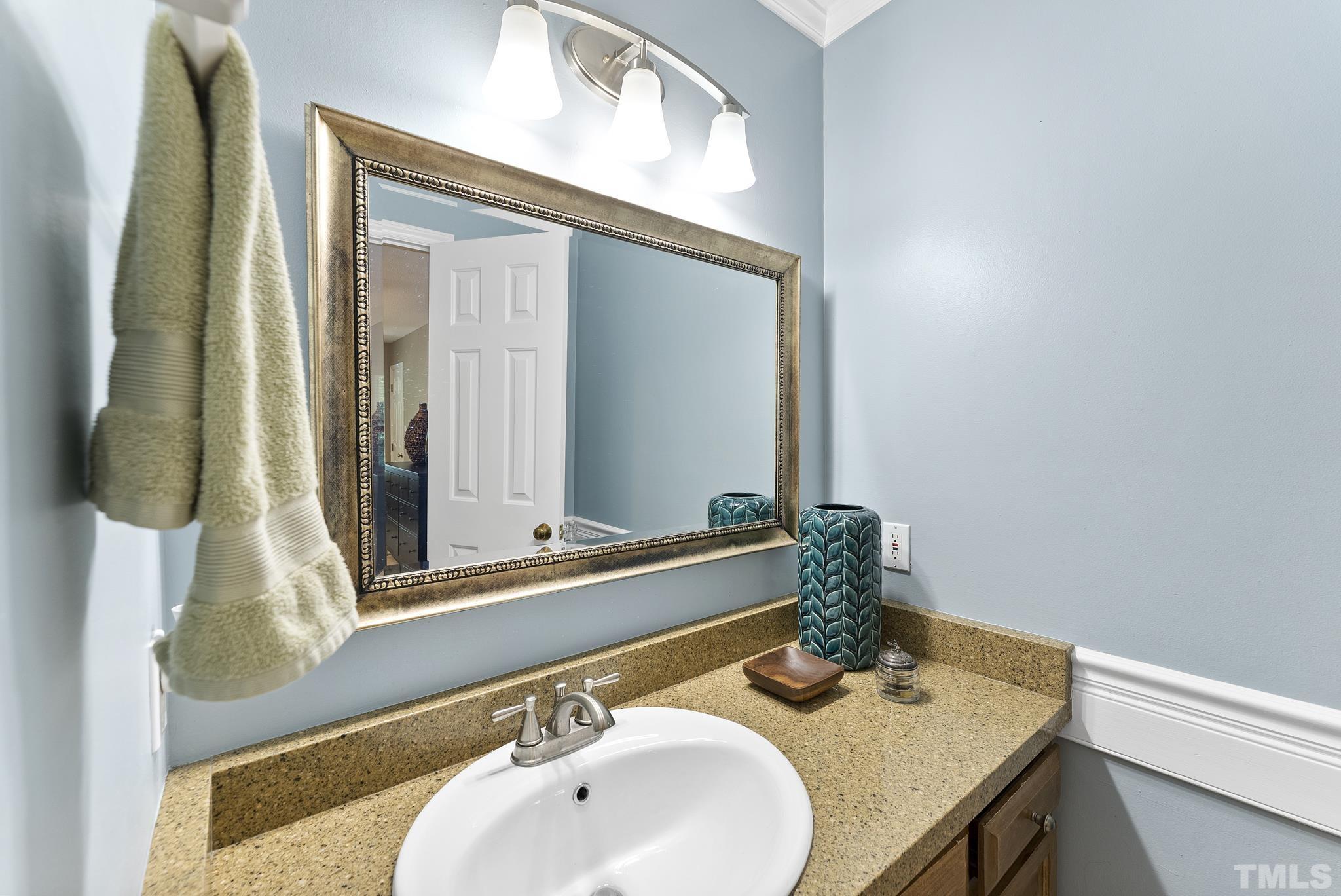 4205 Pleasant Grove Church Road Raleigh, NC 27613 - Photo 15 of 34 a bathroom with a sink and a mirror